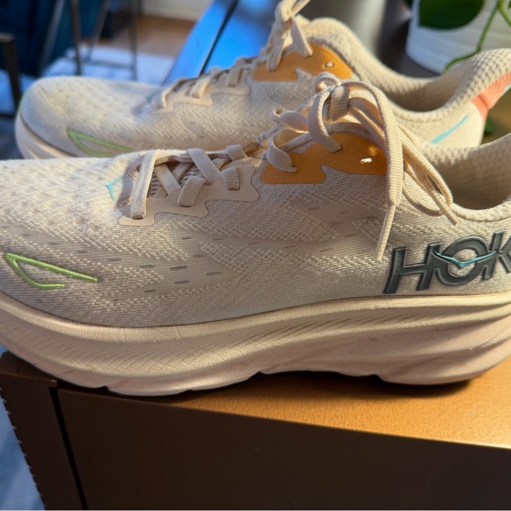Hoka Cream and Orange Sneakers